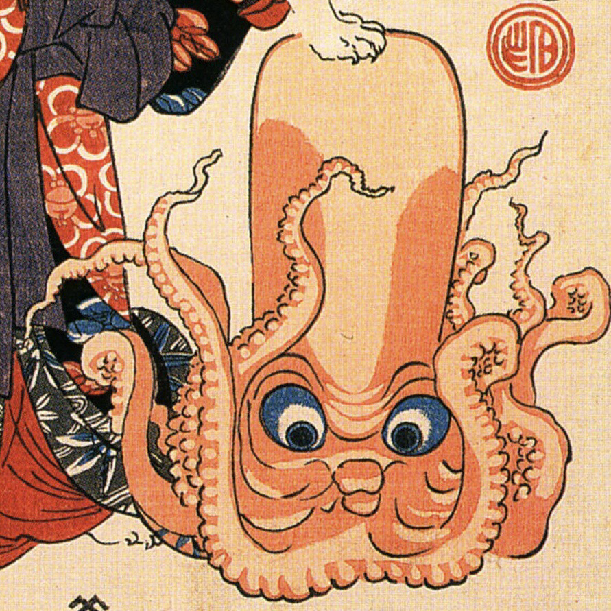 closeup of the octopus, orange with blue eyes